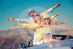 Happy family travel by car in the mountains