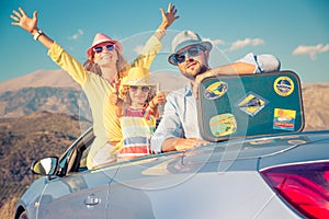 Happy family travel by car in the mountains