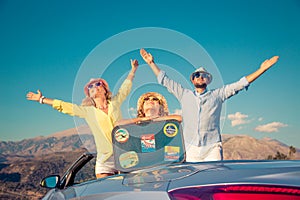 Happy family travel by car in the mountains