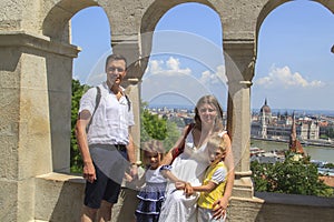 happy family traveling with two children smiling look at the cam