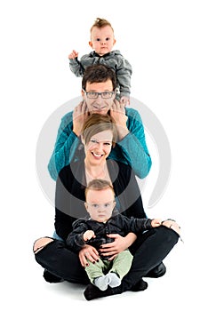 Happy family with twins is laughing. Isolated on white.