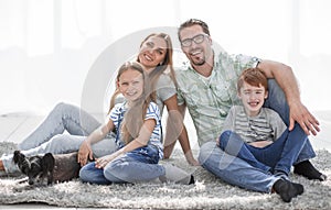 Happy family with two children and a dog