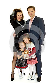 Happy family with two children standing together