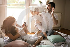 Happy family with two daughters at home.