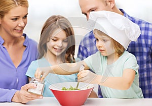 Happy family with two kids eating at home