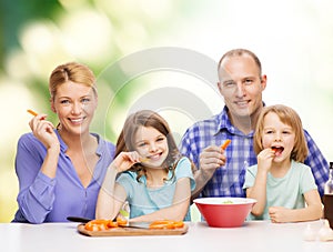 Happy family with two kids eating at home