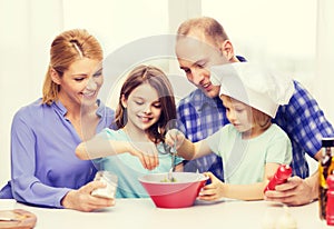 Happy family with two kids eating at home
