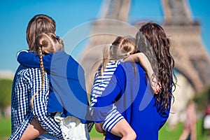 Happy family with two kids in Paris near Eiffel