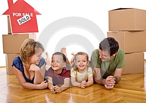 Happy family with two kids in their new home