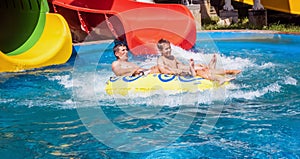 Happy family of two after water park slide