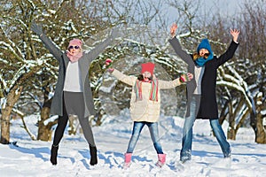 Happy family. Two woman and girl a winter walk in nature