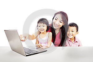 Happy family with ultrabook laptop photo