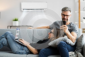 Happy Family Using Air Condition photo