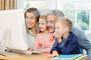 Happy family using the computer