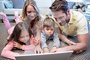 Happy family using the laptop