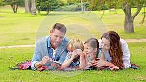 Happy family using tablet computer