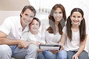 Happy Family Using Tablet Computer At Home