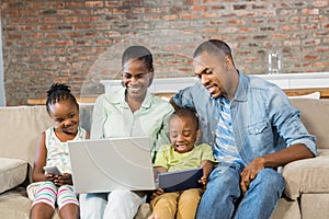 Happy family using technology together