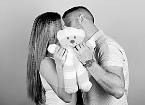 Happy family. Valentines day holiday. Soft toy teddy bear gift. Pregnancy concept. Man and woman couple in love. Family