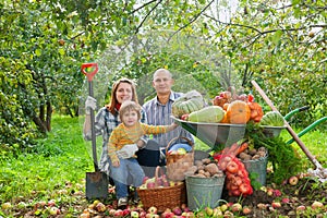 Happy family with vegetables harvest