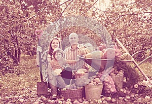 Happy family with vegetables harvest