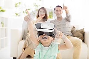 Happy family with virtual reality headset in living room