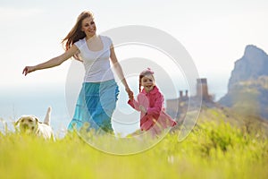 Happy family walking with dog