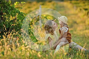 A Happy family walking history. mother and baby hugging in a meadow yellow flowers on nature in summer