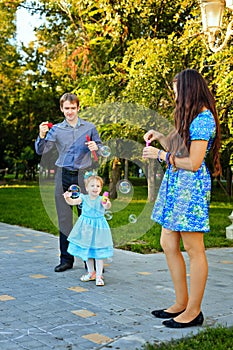 Happy family walking in park