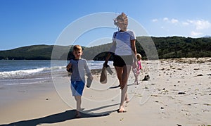 Happy family walking on sand beach sea resort relaxing together enjoying summer travel vacation