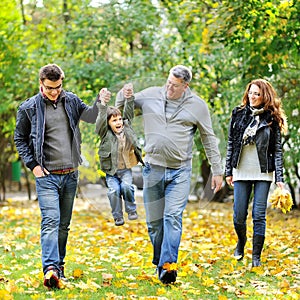 Happy family walking together in a park