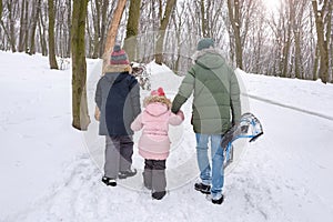 Happy family walking in winter park. Active lifestyle