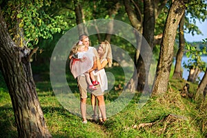 Happy family walks in a lakeside park