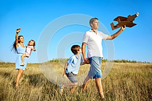 Happy family walks on nature in summer.