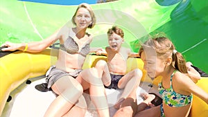 Happy family on water slide