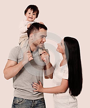 Happy family on a white background. Mother, father and son