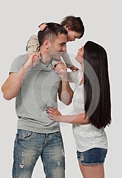 Happy family on a white background. Mother, father and son