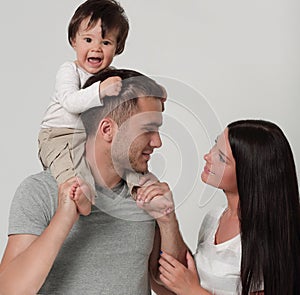 Happy family on a white background. Mother, father and son