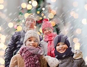 Happy family in winter clothes outdoors