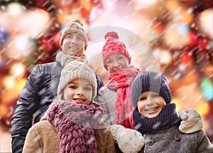 Happy family in winter clothes outdoors