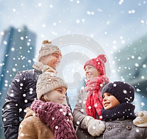 Happy family in winter clothes outdoors