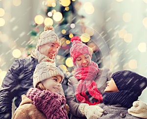 Happy family in winter clothes outdoors