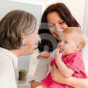 Happy family women - grandmother, mum and baby