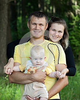 Happy family in wood