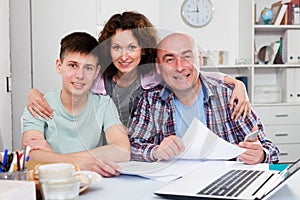 Happy family working with documents