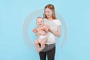 Happy family. young attractive mother with her adorable newborn son having fun