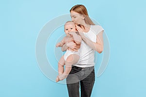 Happy family. young attractive mother with her adorable newborn son having fun