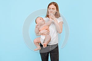 Happy family. young attractive mother with her adorable newborn son having fun