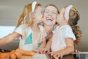 Happy, family and young girls kiss mother in joyful face, smile celebrating mothers day at home. Sisters kissing mom on
