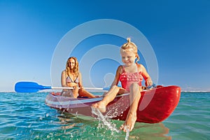 Happy family - young mother, children have fun on boat walk